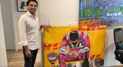 ‘Checo’ Pérez recibe pintura de una artista que inmortalizó su primer triunfo en Fórmula 1