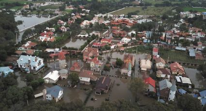 Fuertes lluvias desbordan presa en Tequisquiapan, Querétaro; autoridades desalojan a cientos de familias