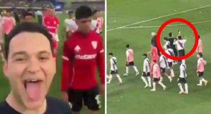 Jugador de River Plate intenta arrebatarle el teléfono a un fan de Boca Juniors que se coló a la cancha para hacer un video con gestos de burla