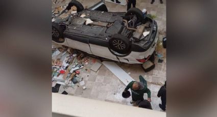 Cae vehículo de un estacionamiento en una plaza de la alcaldía Miguel Hidalgo; mujer de 61 años resultó herida