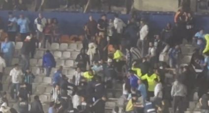 Aficionados del Pachuca pelean con elementos de seguridad en el Estadio Hidalgo por usar bengalas en juego ante el América