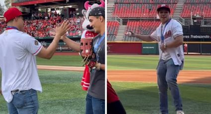 Osmar Olvera, campeón del mundo en clavados, lanza la primera bola al abrir los playoffs de los Diablos Rojos del México; su 'socio' Juan Celaya hizo de receptor